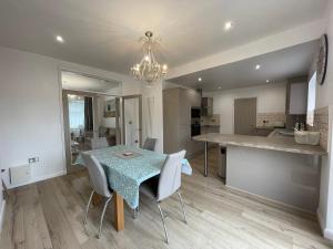 a kitchen and dining room with a table and chairs at The Villas holiday homes in Horden