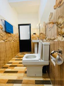 a bathroom with a white toilet in a room at Ella 78 Resort in Ella +27 photos