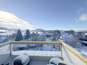 a snow covered balcony with a view of a snow covered mountain at Wohlfühloase in Wenslingen in Wenslingen