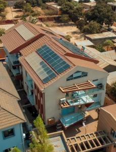 an overhead view of a house with solar panels on the roof at Immeuble Avenue 30 Juin - Lubumbashi in Lubumbashi