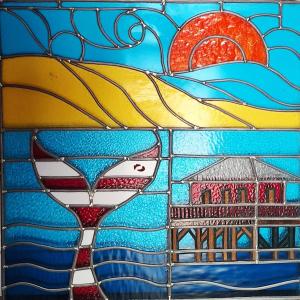 a stained glass window with a picture of a building at Le vitrail d'Arcachon - Appt Spacieux Terrasse Ménage draps inclus in Arcachon