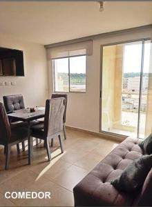 a living room with a table and a couch at Capriella,Cartagena in Cartagena de Indias