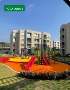 a playground in front of a apartment building at Capriella,Cartagena in Cartagena de Indias
