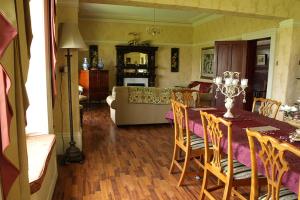 a living room with a table and a couch at Duddon Villa in Millom
