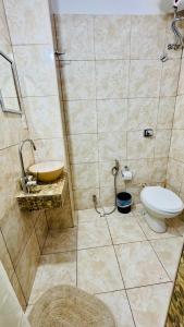 a bathroom with a toilet and a sink at Monoambiente Eldorado 6 in Eldorado +14 photos