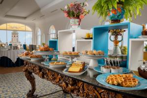 a buffet of food on a table in a room at Tramonto d'Oro in Praiano