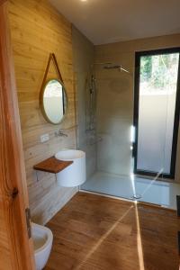 a bathroom with a shower and a sink at Chez Oreste - Escapade à 2 avec sauna et jardin clos in Aywaille