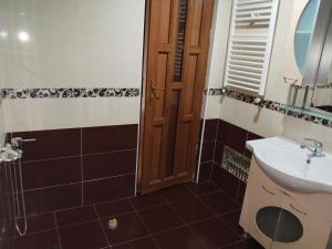 a bathroom with a sink and a mirror at Vanilla Mountains in Kutaisi +81 photos