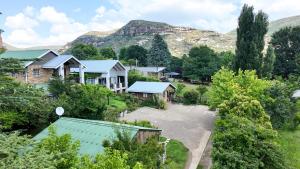 an aerial view of a village with houses and trees at Stonehaven Clarens in Clarens