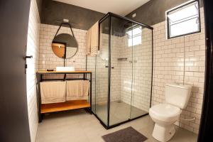 a bathroom with a shower and a toilet at Villa Container in the Wine Route in São Roque +31 photos