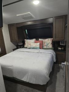 a bed in an rv with some pillows on it at Courtside Villa at Key Largo in Key Largo +28 photos