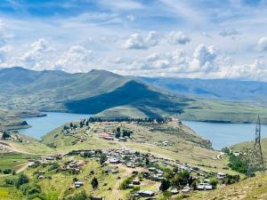 a small town on a hill with a lake at Bernliz Guest House in Bokong +4 photos