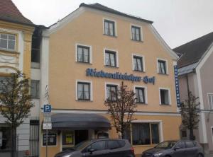 a building with a sign on the front of it at Niederalteicher Hof in Hengersberg