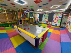 a play room with a ping pong table in it at Stella in Ternopil