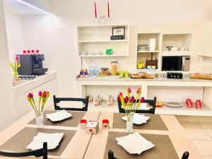 a dining room with a table and chairs at Athena Luxury Rooms in Reggio di Calabria