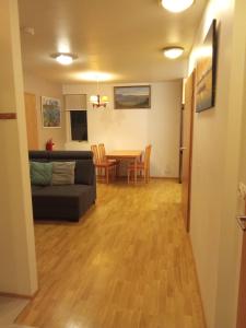 a living room with a couch and a table at Quiet, two bedroom apartment in Reykjavík