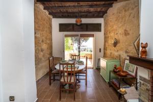 a dining room with a table and chairs at Charming villa with pool and unobstructed view in Tangier