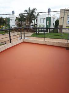 a pool of orange water on a roof at Alfonsina 2 in Colón