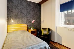 Postel nebo postele na pokoji v ubytování Hotell City