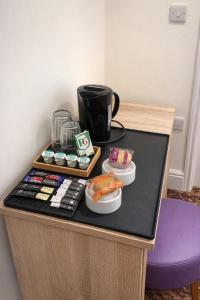 a table with sushi and a coffee mug on it at The Miles Arms Hotel in Avonmouth +16 photos