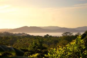 a view of the water with mountains in the background at Hotel Sol y Mar in Santa Catalina +80 photos