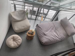 a living room with a couch and a chair at Ferienhaus am Dürrbachtal in Unterleinleiter