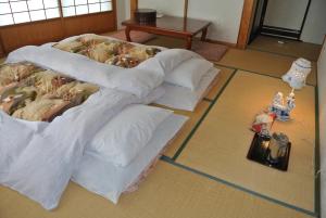 Voodi või voodid majutusasutuse Shinazawa toas