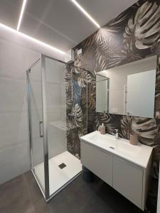 a bathroom with a sink and a shower at Appartamento Leon in Roseto degli Abruzzi