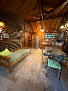 a bedroom with a bed and a table in a room at Rio Manso Tigre in Tigre