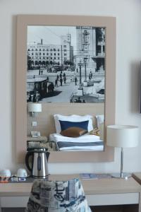 a black and white photo of a bed in a room at Five Points Square - City Center in Belgrade