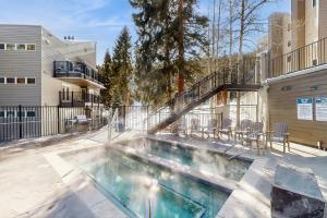 a swimming pool in the backyard of a house at Iron Horse Resort #C1083 in Winter Park
