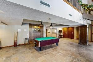 a pool table in the middle of a room at Iron Horse Resort #C1083 in Winter Park