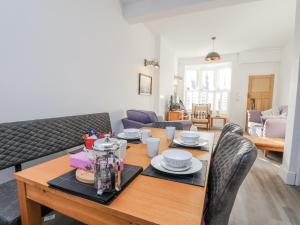 a living room with a table and a couch at 1 Castle Terrace in Thirsk