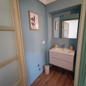 a bathroom with a sink and a mirror at Charme a Corniglio in Corniglio +45 photos
