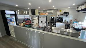 a fast food counter in a restaurant with a counter at Haileybury Beach Motel in Haileybury