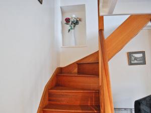 a staircase with a vase of flowers on the wall at Sunnyside in Sandsend