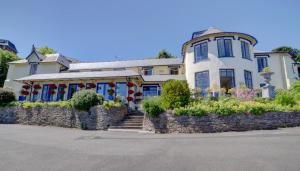 a large white house with a stone wall at 2 Bed in Lynton oc-lyncha in Lynmouth