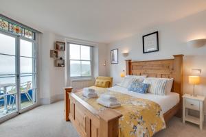 a bedroom with a large bed and a large window at 2 Bed in Lynton oc-lyncha in Lynmouth