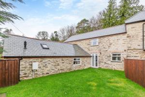 an exterior view of a brick house with a yard at 3 Bed in Yeolmbridge oc-t30293 in Werrington