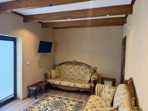 a living room with a couch and a table at ELEGANT HOUSE Cappadocia in Göreme