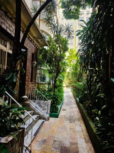 a walkway in a building with trees and plants at 2 BEDROOM Condo -IPANEMA in Rio de Janeiro
