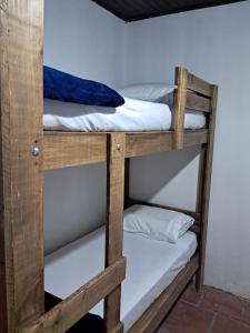 a pair of bunk beds in a room at Casa Aconchego in São Gabriel