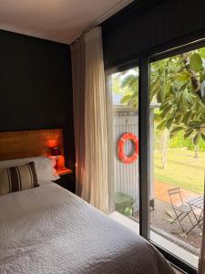 a bedroom with a bed and a large window at La Lagartija Adults Only in Ajo +79 photos