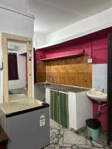 an unfinished bathroom with a sink and a sink at Prakriti Resort in Arambol
