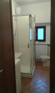 a bathroom with a shower and a sink and a toilet at casa vacanze crochi in Viterbo +14 photos