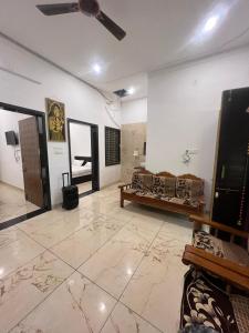 a living room with a couch and a table at Vasudeva Villas in Udaipur