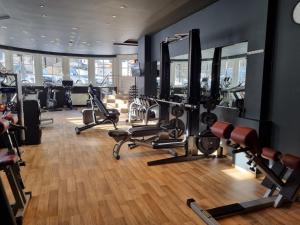 a gym with several treadmills and cardio machines at Verwöhnhotel Wildspitze in Sankt Leonhard im Pitztal