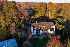 an aerial view of a large house with trees at The Fairways House in Glenrothes