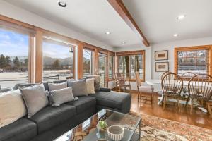 a living room with a couch and a table at Abode at Open Meadows in Wilson