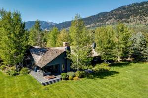an aerial view of a house in a field at Abode at Open Meadows in Wilson